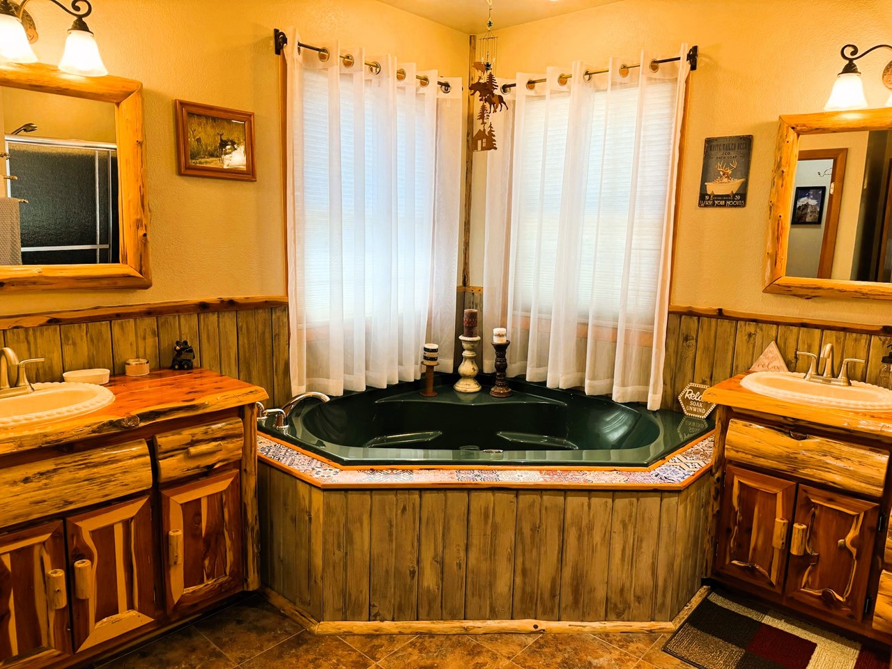 straight ahead is a jetted soaking tub and lavatories on either side...