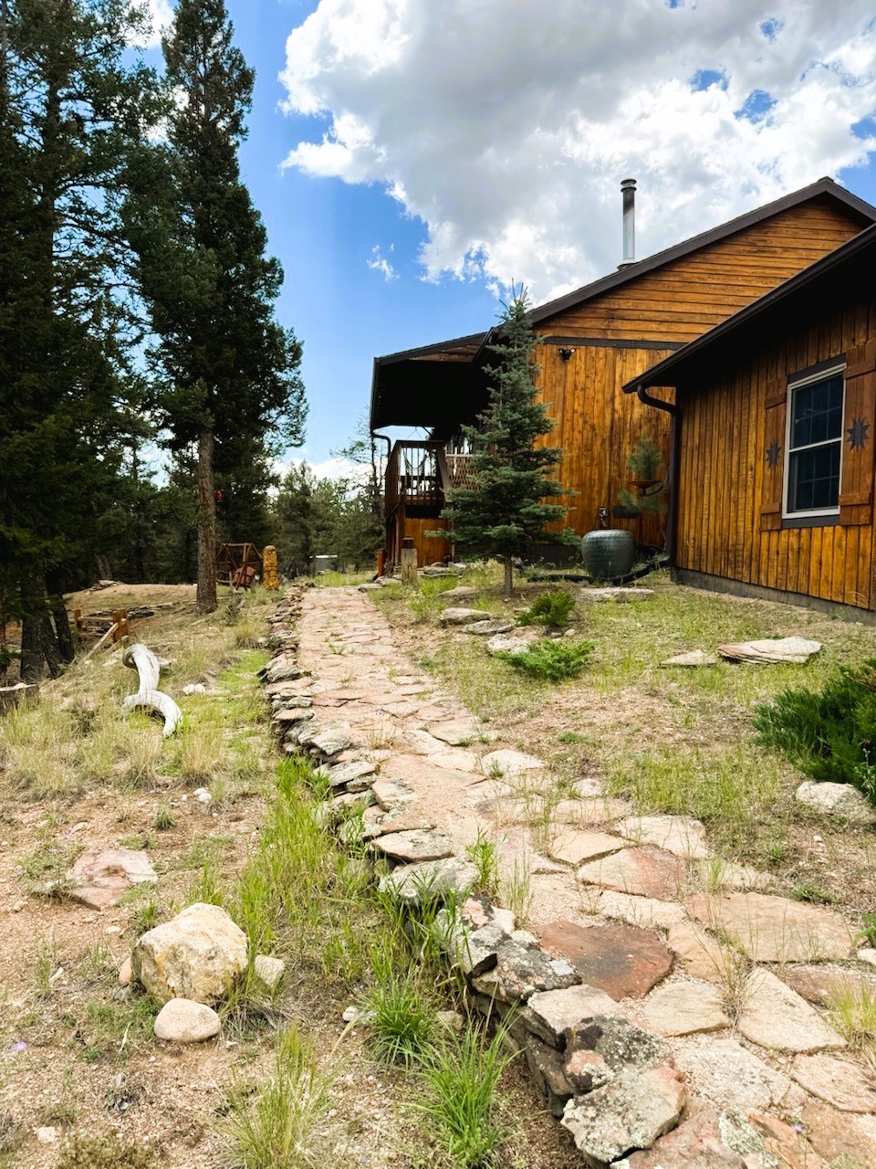 a rocked path to the front deck and front door