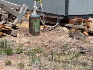 well head just outside of the storage shed