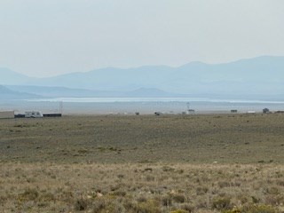 zoomed view southeast over the lot to spinney reservoir and 39-mile mountain (obscured by smoke from az, ut and western colorado)