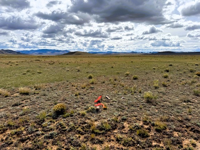 view southwest over the lot from the northeast corner pin
