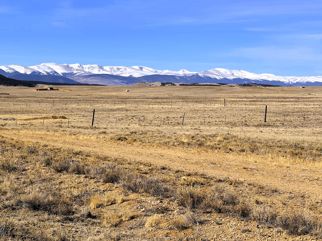 zoomed north northwest from the property over moffatt rd to snow capped mountain peaks zoomed north northwest from the property over moffatt rd to snow capped mountain peaks