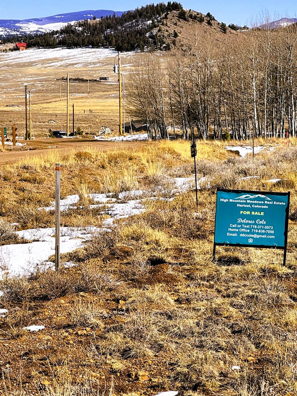 view from the center front of the property to power poles one lot east of the property